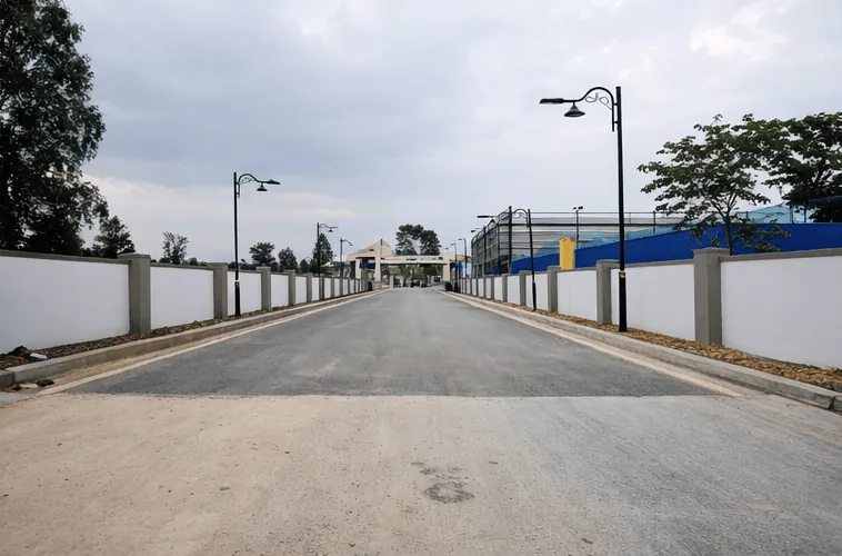 Concrete road with street lights at Kuteera